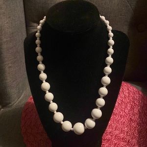 Claire’s white plastic graduated bead necklace